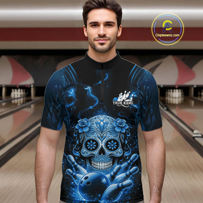 Male model at a bowling lane wearing a black and blue quarter-zip bowling shirt with colorful sugar skull artwork and bowling accents.