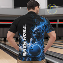 Load image into Gallery viewer, Front view of a male model in a bowling alley wearing a black quarter zip bowling shirt with a blue flaming skull, lightning, bowling pins, and a custom name.
