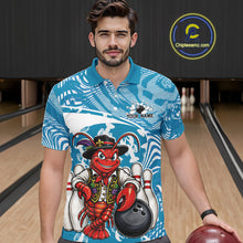 Load image into Gallery viewer, Front view of a male model in a bowling alley wearing a blue custom bowling polo shirt with a funny Cajun crawfish leaning on a bowling ball and a swamp inspired texture background.