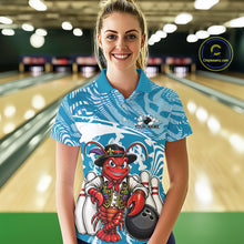 Load image into Gallery viewer, Front view of a female model in a bowling alley wearing a blue custom bowling polo shirt with a funny Cajun crawfish leaning on a bowling ball and a swamp inspired texture background.