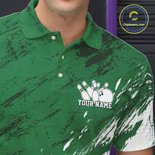 Load image into Gallery viewer, Close up of the left chest area on a white and green bowling polo shirt featuring a splatter style sports jersey design