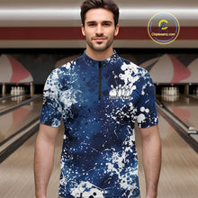 Load image into Gallery viewer, Man wearing a blue and white patterned shirt with a bowling alley in the background