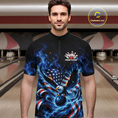 Front view of a male model in a bowling lane wearing a quarter zip shirt with flaming eagle motif, blue bowling ball, American flag, and blue flames.