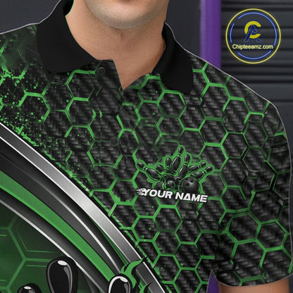 Close-up of the left chest area of a black and green bowling polo shirt, featuring honeycomb pattern with a flaming bowling ball hitting pins.