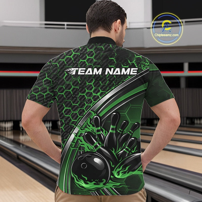 Male model at a bowling venue wearing a black and green quarter zip shirt, featuring honeycomb texture and a dynamic flaming bowling strike artwork.