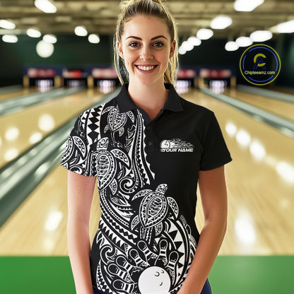 Female model wearing a black and white bowling polo shirt at the bowling lane with tribal swirl bowling graphics and Polynesian-inspired artwork.