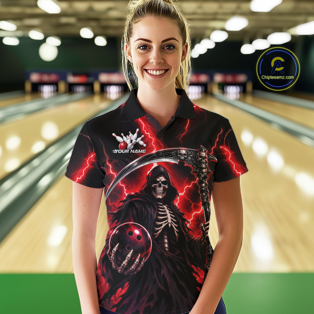 A woman wearing a black short-sleeve polo shirt with a grim reaper graphic, standing in front of a blurred bowling alley background. The shirt features a detailed print of a skeletal figure holding a bowling ball, red lightning, and a scythe, with 'YOUR NAME' and a bowling pin graphic on the chest.