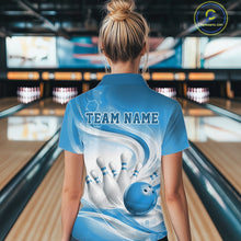 Load image into Gallery viewer, Female model standing in a bowling lane showing the back of a white and blue bowling polo shirt with abstract wave lines and a glossy bowling ball striking pins graphic.