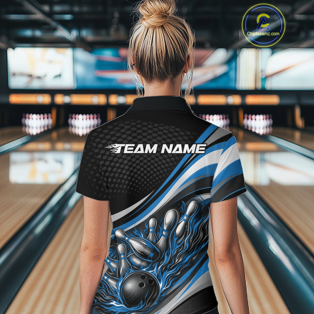 Back view of a female bowler wearing a black and blue polo shirt, flame bowling strike artwork with scattered pins motion effect.