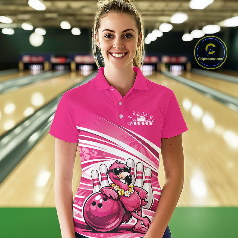 Female model wearing a pink bowling polo shirt at a bowling lane with a tropical flamingo in sunglasses beside a bowling ball.