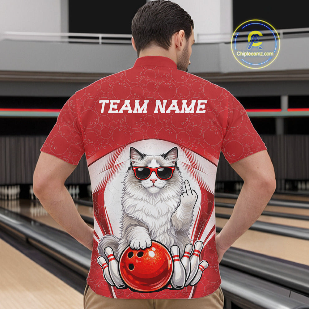 Front view of a male model in a bowling alley wearing a white and red quarter-zip shirt featuring a ragdoll cat beside a bowling ball.