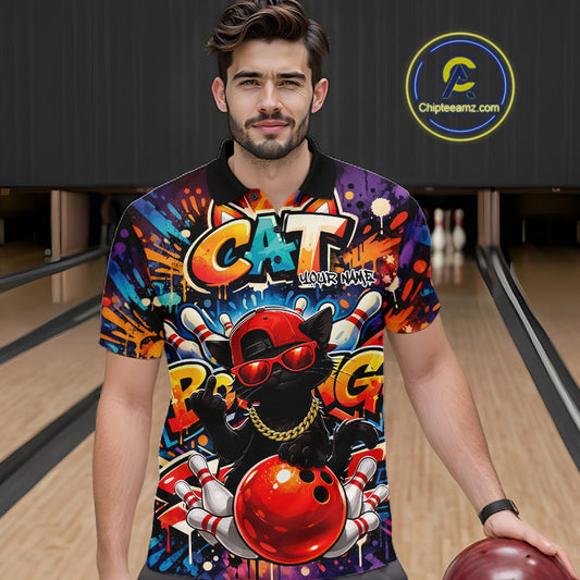 Male model at a bowling lane wearing a colorful bowling polo shirt with graffiti-style black cat artwork, sunglasses, cap, and bowling ball graphics.
