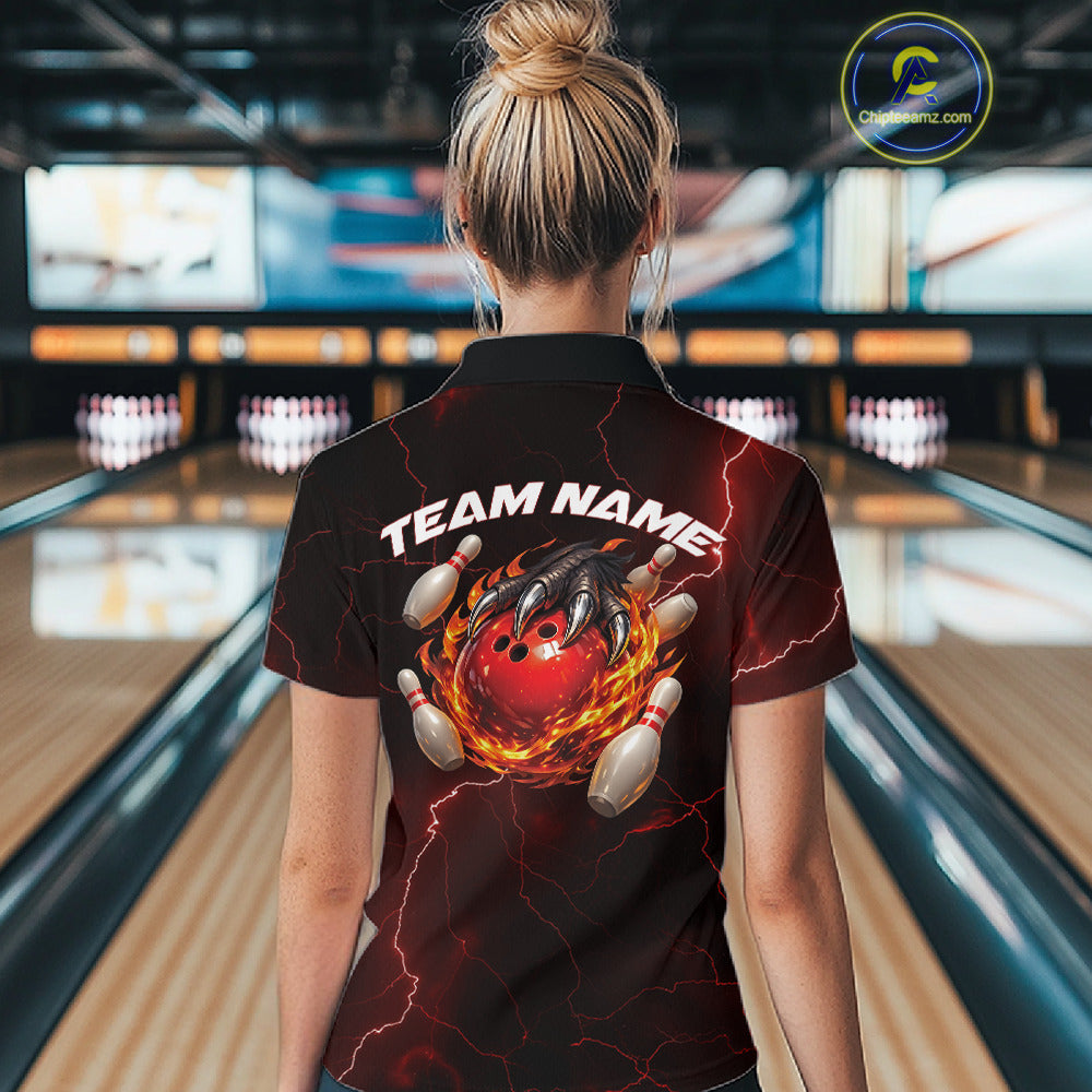 Back view of a black and red womens bowling polo showcasing a dragon claw holding a flaming bowling ball with scattered pins.