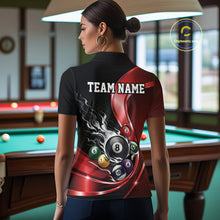 Load image into Gallery viewer, Back view of a female model in a black and red billiard polo with metallic ribbons, honeycomb artwork, and scattered pool balls