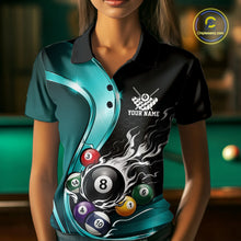 Load image into Gallery viewer, Female model wearing a black and blue billiard polo with metallic ribbons, dark honeycomb graphics, and a flaming 8-ball, front view at the bowling lane