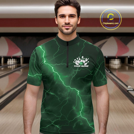 Male model wearing a bowling quarter-zip with green cobra artwork and lightning fantasy accents in a bowling lane.