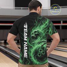 Load image into Gallery viewer, Male model wearing a black bowling quarter-zip shirt in a bowling alley featuring a skull clutching a bowling ball with swirling green energy flames