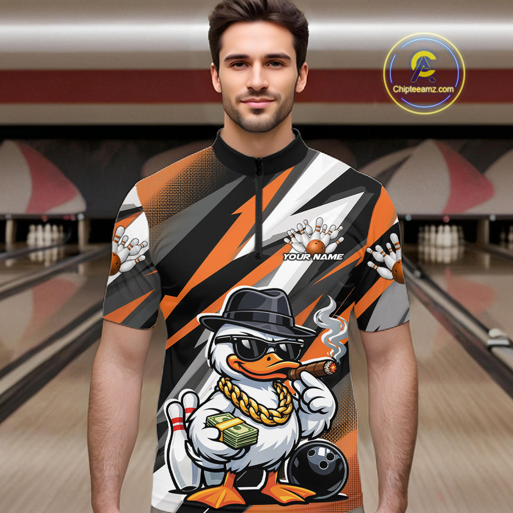 Male model in bowling lane wearing quarter-zip shirt with patriotic duck bowling ball graphic