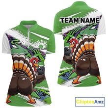 Load image into Gallery viewer, Front and back views of a green custom women's quarter zip bowling shirt featuring a funny graffiti turkey holding a bowling ball, paint splatter accents, and a personalized name.