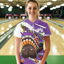 Load image into Gallery viewer, Front view of a happy female model in a bowling alley wearing a purple custom quarter zip bowling shirt with a funny graffiti turkey holding a bowling ball, paint splatter accents, and a personalized name.