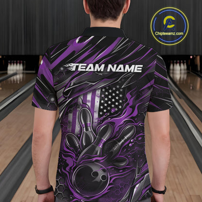 Back view of a male model in a bowling venue wearing a black and purple polo shirt showcasing a flaming bowling ball and patriotic pin motif.