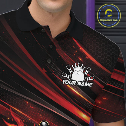 Close-up left chest detail of a black and red-orange bowling polo shirt featuring a flaming bowling ball knocking down pins.