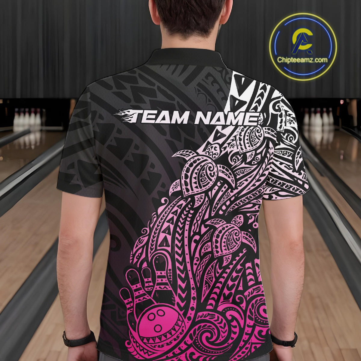 Back view of a male model in a black and pink bowling polo shirt showcasing tribal swirl graphics and turtle-themed accents.
