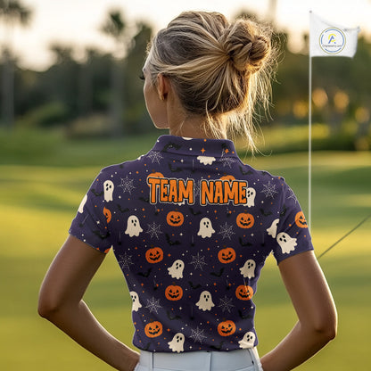 A woman viewed from behind on a golf course, wearing a navy blue short-sleeve collared shirt with a Halloween print of pumpkins, ghosts, and spiders, and 'TEAM NAME' printed across the upper back.