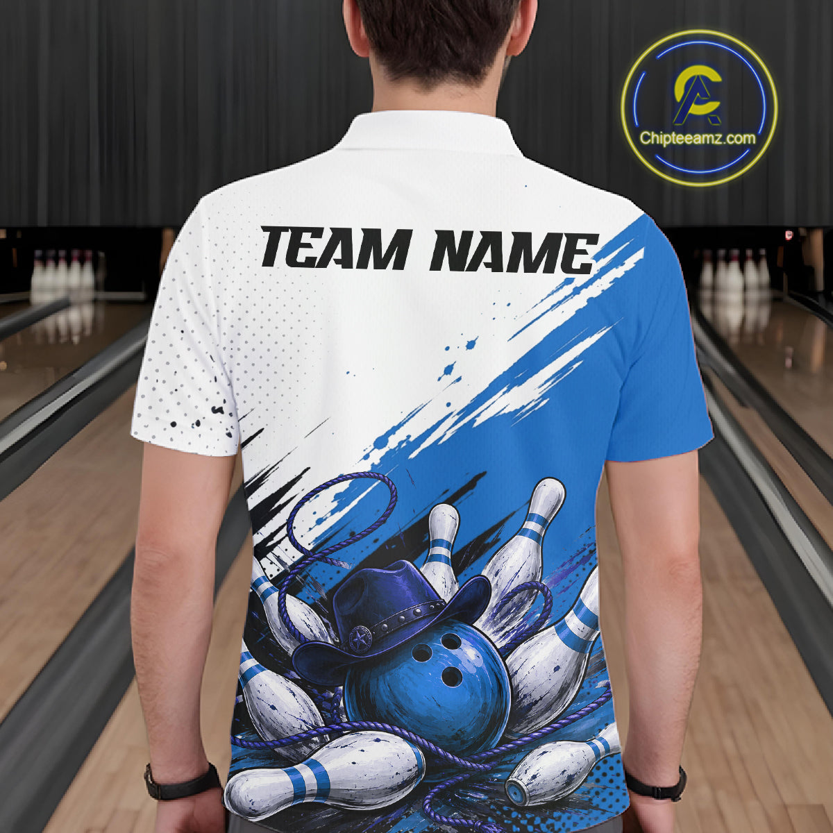 A man viewed from behind wearing a custom short-sleeve polo shirt with a bowling-themed graphic print. The shirt features 'TEAM NAME' printed on the back, a white upper section with black dots, a blue right shoulder, and a graphic of bowling pins, balls, and a hat at the bottom.