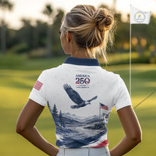 Load image into Gallery viewer, Woman on a golf course wearing a polo shirt with an eagle design and text.