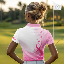 Load image into Gallery viewer, Woman in a pink and white golf shirt with butterfly design on a golf course