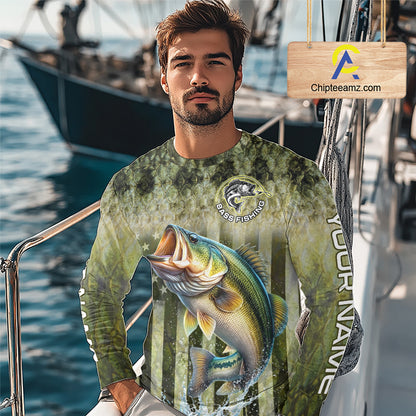 Man wearing a fishing-themed shirt with a large bass graphic on a boat 