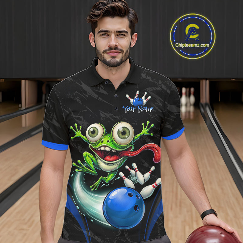 A man in a bowling alley wearing a black short-sleeve polo shirt with a colorful frog and bowling ball graphic on the front, holding a bowling ball. A circular 'Chipleeamz.