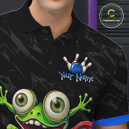 A close-up of a person wearing a black short-sleeve polo shirt with a cartoon graphic of a green monster and bowling pins. The shirt has a custom text placeholder reading 'Your Name' next to the bowling motif.