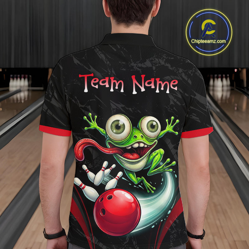 A person viewed from behind wearing a black short-sleeve bowling-themed shirt with a large green frog and red bowling ball graphic on the back, plus 'Team Name' text across the upper back. Bowling lanes are visible in the background, and a circular 'Chipteeamz