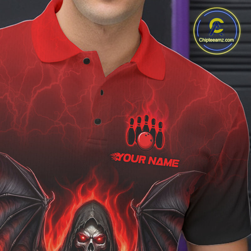 A close-up of a red short-sleeve polo shirt with a custom graphic design. The design features a black bowling pin silhouette with a red bowling ball and the text 'YOUR NAME' on the chest, and a grim reaper with glowing red eyes and wings at the bottom.