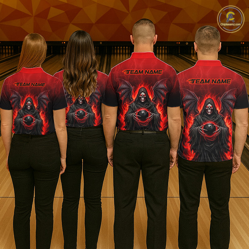 Four people standing with their backs to the camera in a bowling alley, wearing matching red and black short-sleeve bowling shirts with a fiery grim reaper graphic and 'TEAM NAME' printed across the shoulders.