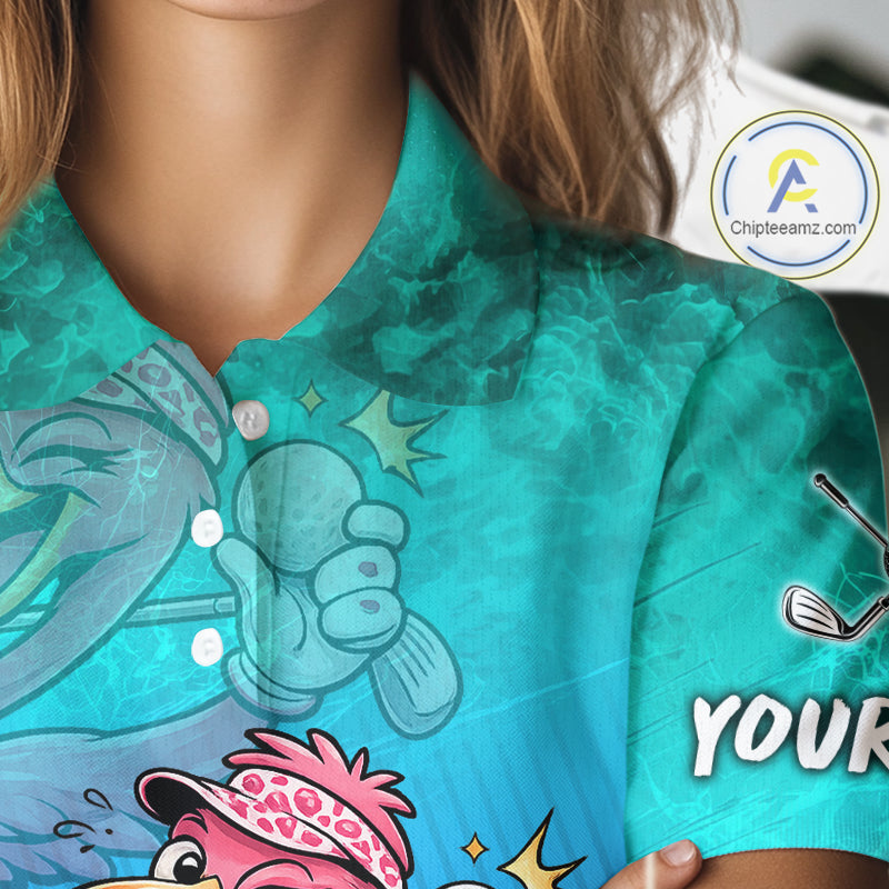 A close-up of a person wearing a short-sleeve collared polo shirt with a bright turquoise and blue watercolor-style print. The shirt features cartoon golf-themed graphics, including a golf ball, clubs, and a pink hat, plus partial white text on the sleeve.