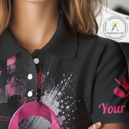 Close-up of a person wearing a black polo shirt with a pink and white abstract graphic print, featuring a collar, snap buttons, and a sleeve graphic with the word 'Your Name'.