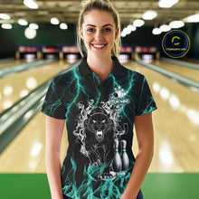 Load image into Gallery viewer, Woman wearing a turquoise flaming panther bowling polo shirt at a bowling alley front view.