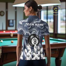 Load image into Gallery viewer, Back view of woman wearing a blue marble swirl 8 ball pool shirt in a billiards hall.