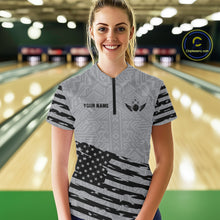 Load image into Gallery viewer, Front view of woman wearing a grey American flag bowling polo shirt inside a bowling alley.