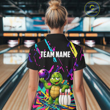 Load image into Gallery viewer, Person wearing a colorful bowling-themed shirt with a turtle design in a bowling alley.