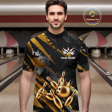 Load image into Gallery viewer, Man wearing a black and gold bowling shirt with a crown design in a bowling alley.