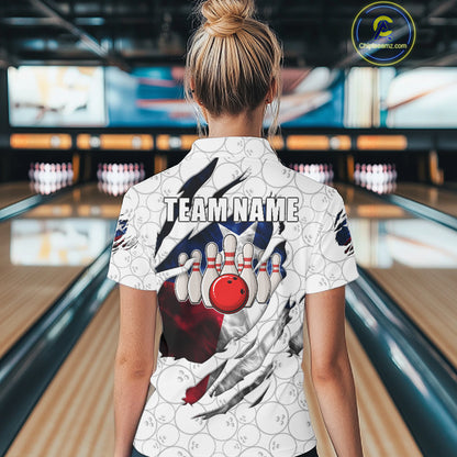 Back view of woman wearing a smoke Texas flag white bowling polo shirt inside a bowling alley.