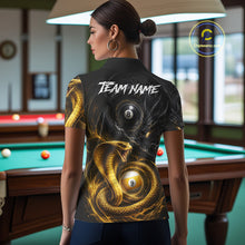 Load image into Gallery viewer, Back view of woman wearing an 8 ball 9 ball cobra snake and dragon pool team shirt in a billiards hall.
