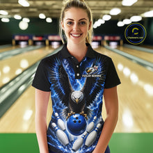 Load image into Gallery viewer, Woman wearing a blue thunder lightning eagle bowling polo shirt at a bowling alley front view.