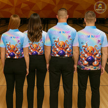 Load image into Gallery viewer, Back view of bowling team wearing matching rainbow octopus bowling shirts in a bowling alley.