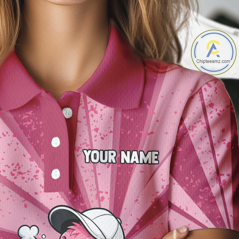 Female golfer wearing custom pink flamingo golf polo during a sunny golf tournament, breathable performance golf apparel for women golfers, tropical vacation lovers, flamingo enthusiasts and resort lifestyle fans. Symbolizes confidence, elegance, freedom and joyful living.