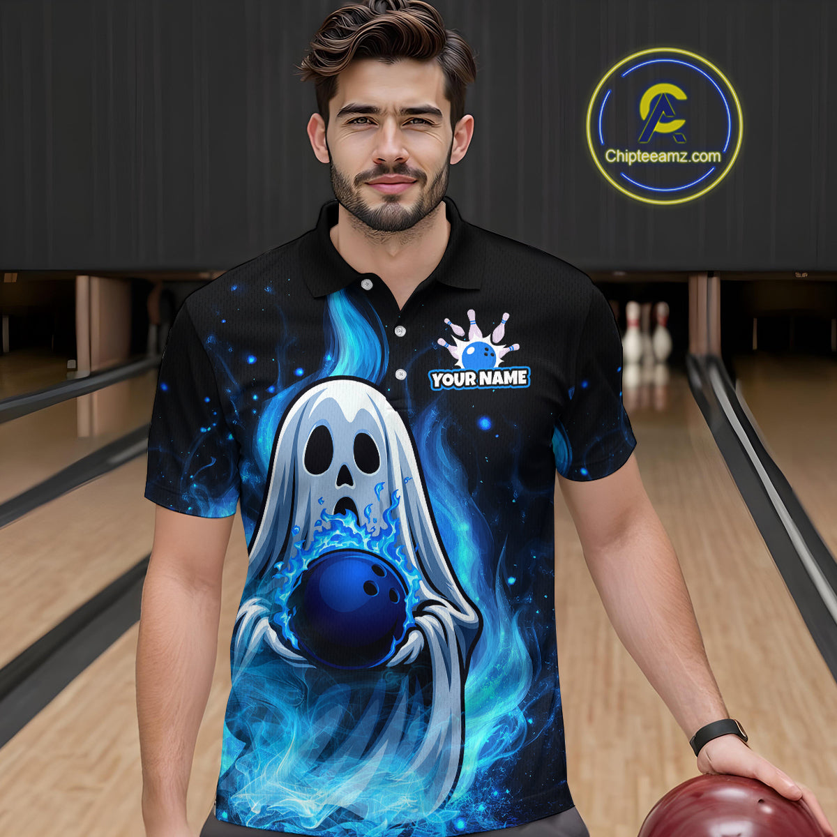 Man wearing a black polo shirt with a ghost and bowling ball design in a bowling alley.